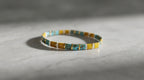 Pulsera Miyuki Tila en color mostaza, azul turquesa y dorado
